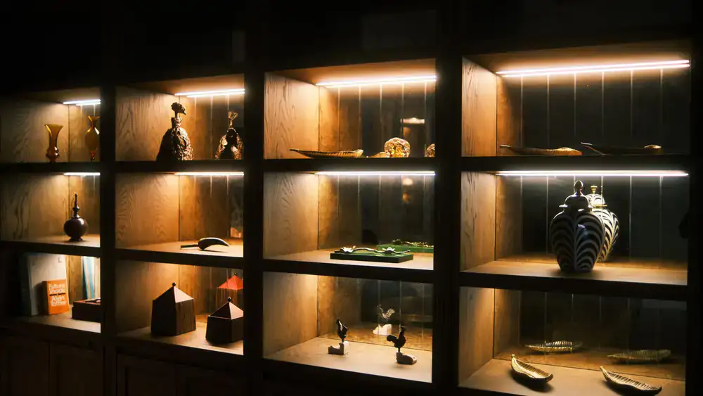 Wooden shelving unit displaying ceramics
